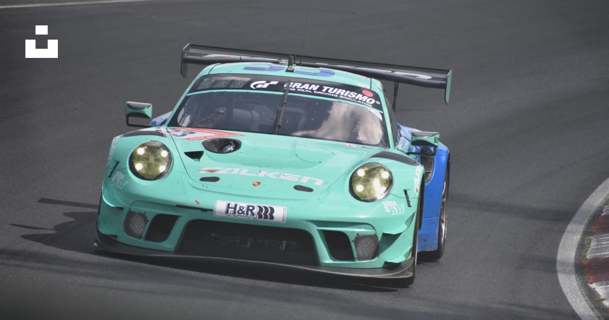 A blue race car on a track photo – Free Nürburgring Image on Unsplash