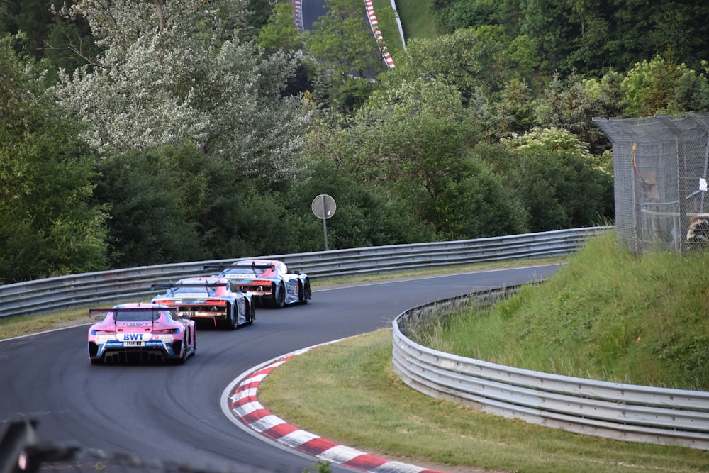 a group of race cars on a track