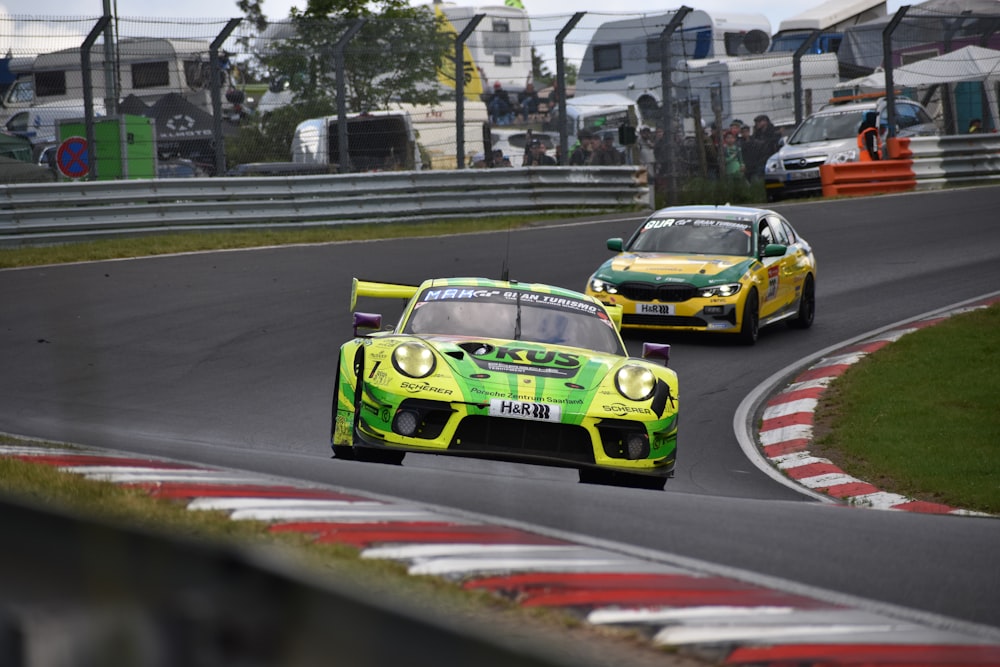 a couple of race cars on a race track