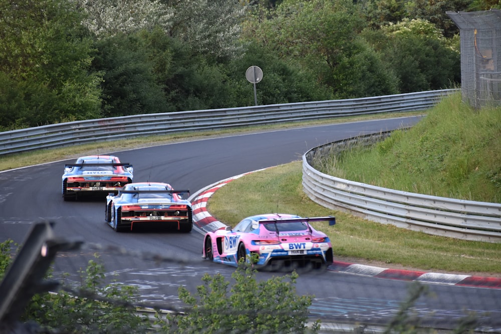 a group of race cars on a track