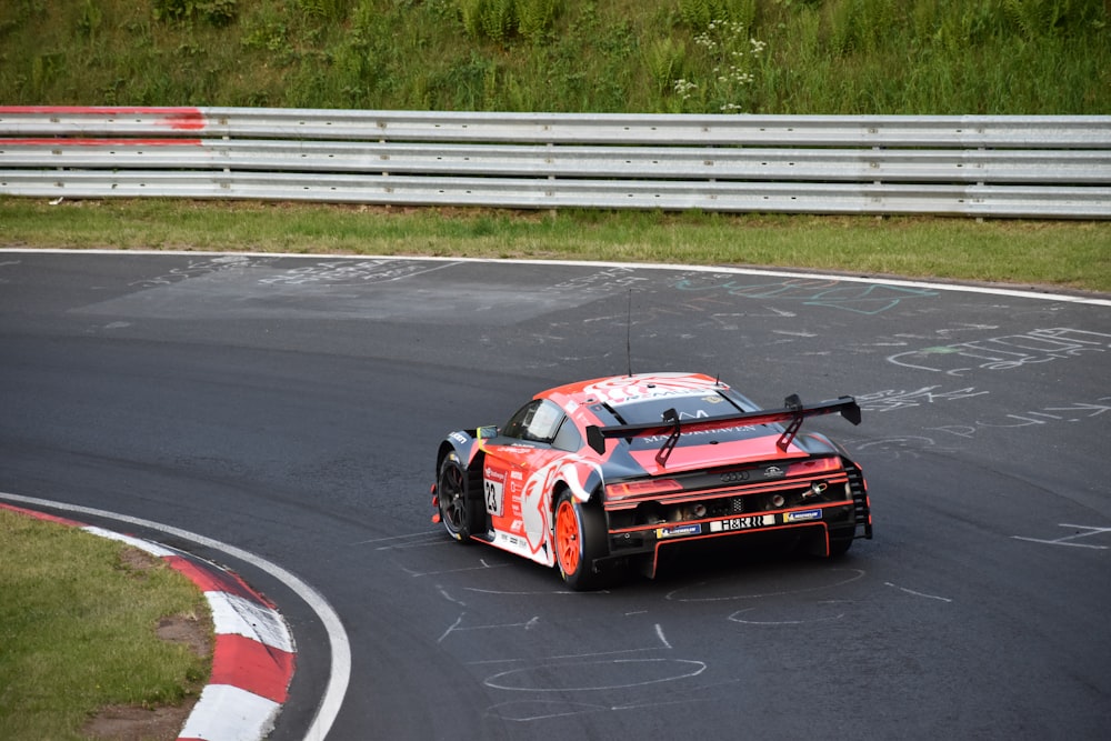 a red race car on a track