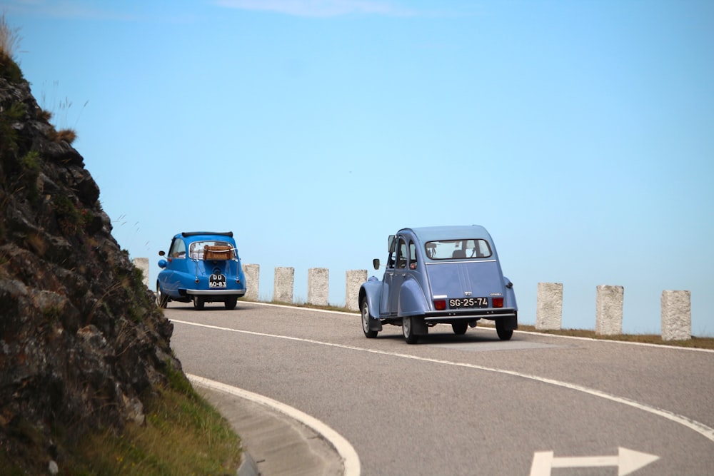 a couple of cars on a road