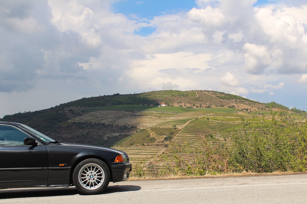 a black car parked on a road