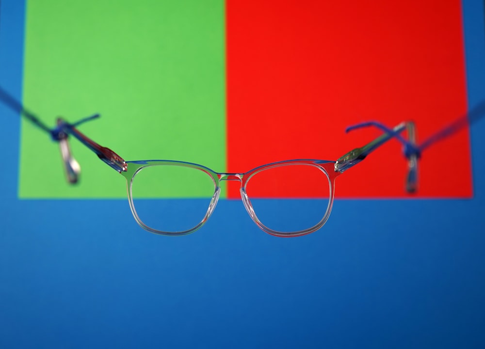 a pair of glasses on a green surface