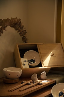 a table with a plant and a plate on it