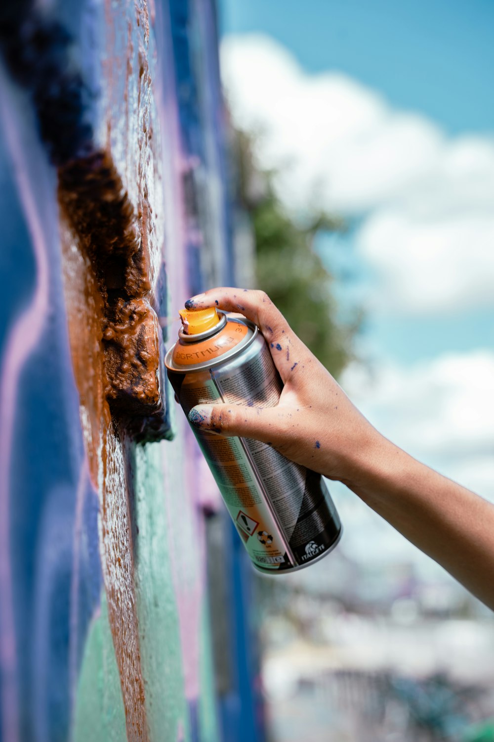 a person holding a can