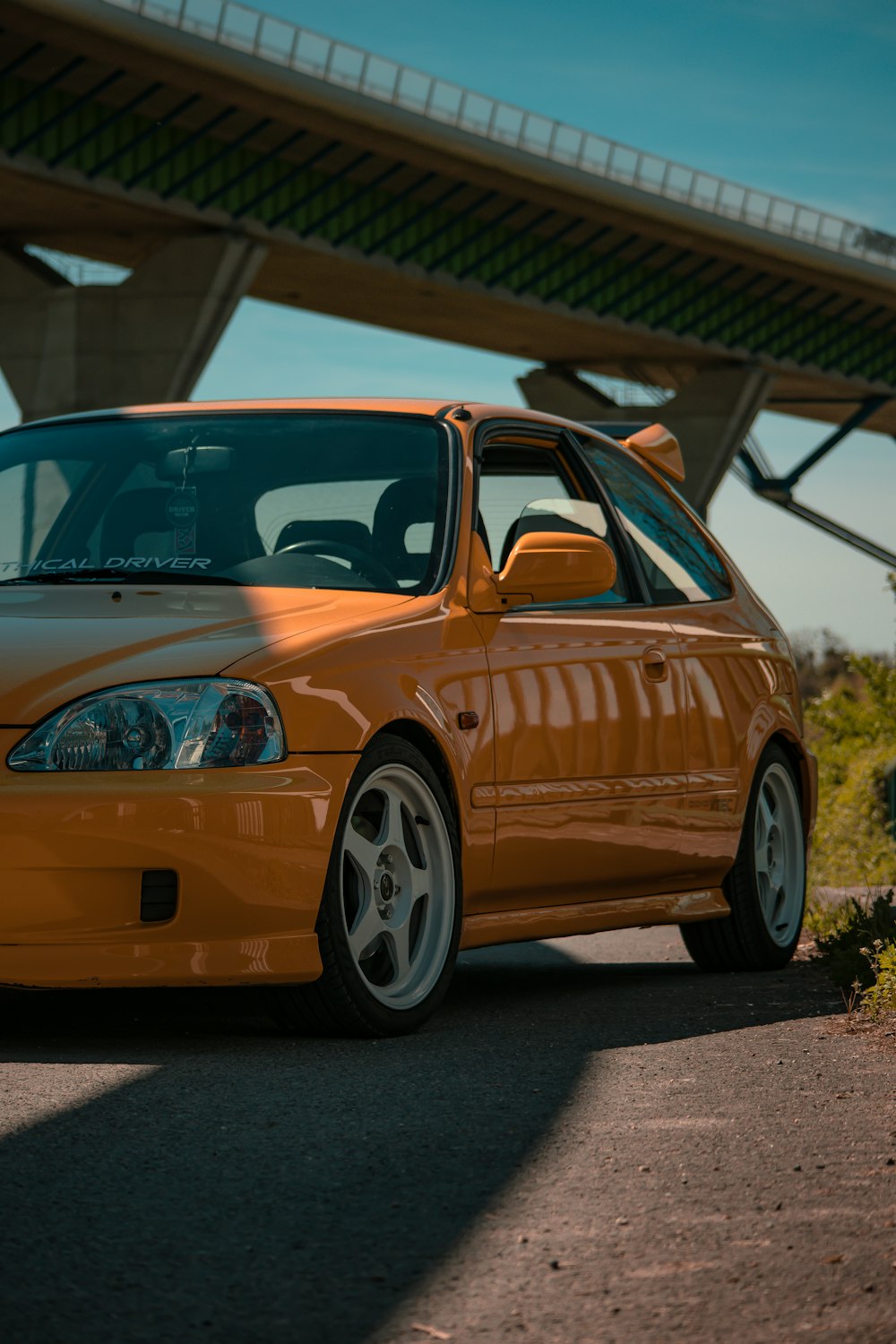 a car parked under a bridge