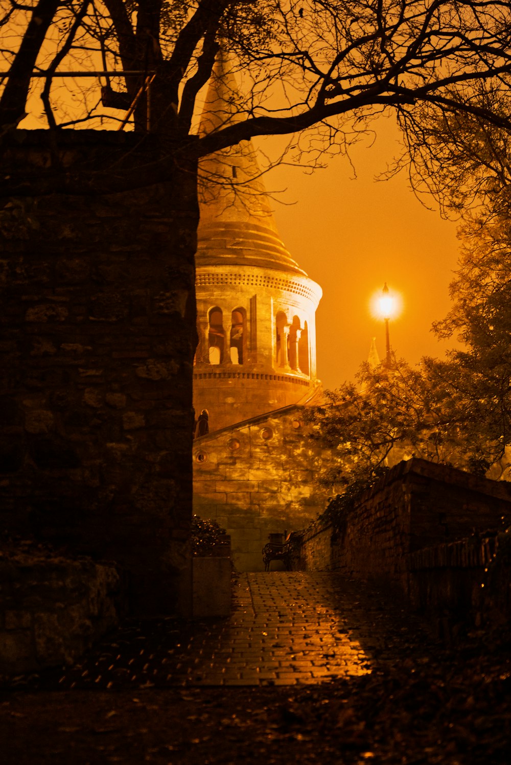 a stone tower with a light on top