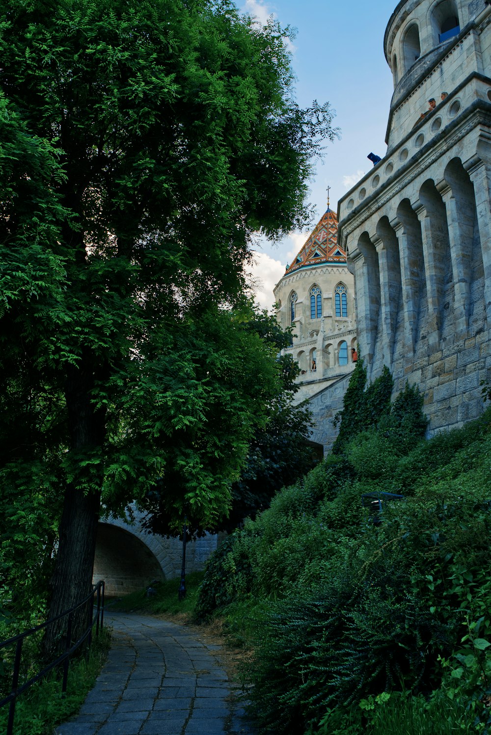 a stone walkway leading to a castle