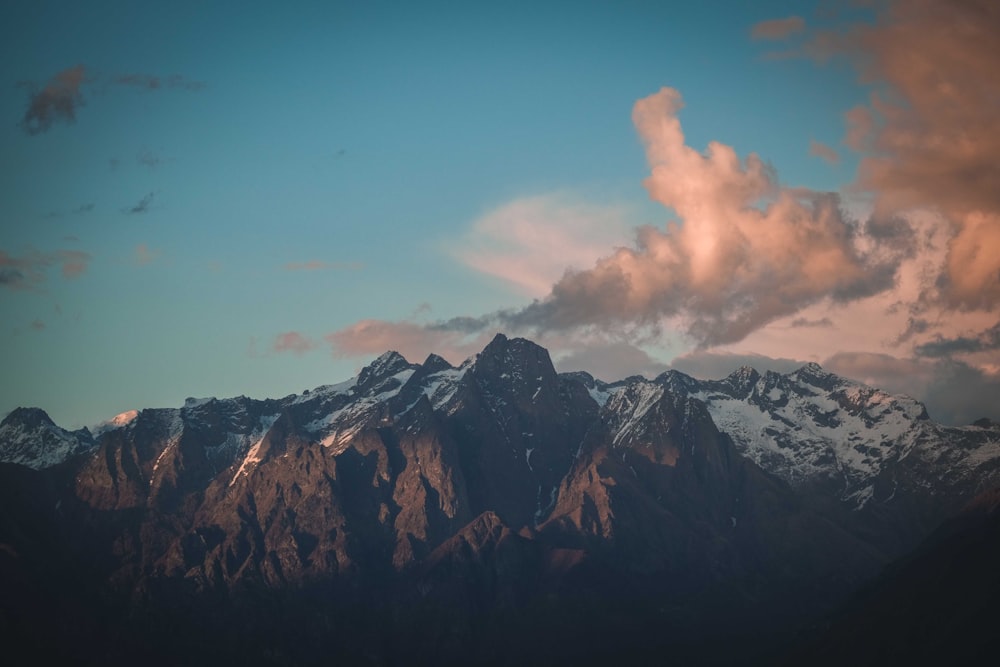 a mountain range with clouds