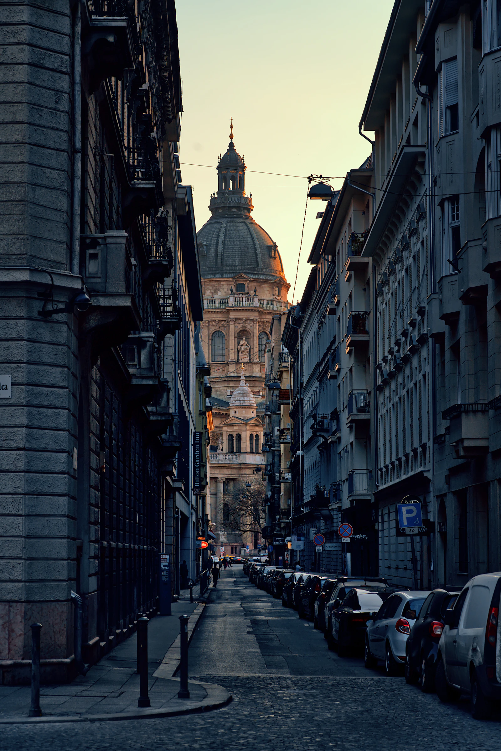 Cars parked along a narrow street in central Budapest