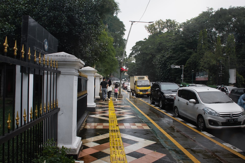 a street with cars and people