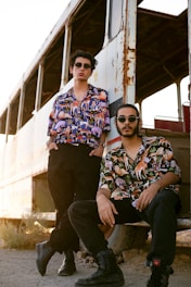 two men sitting on a bench