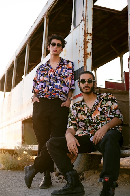 two men sitting on a bench