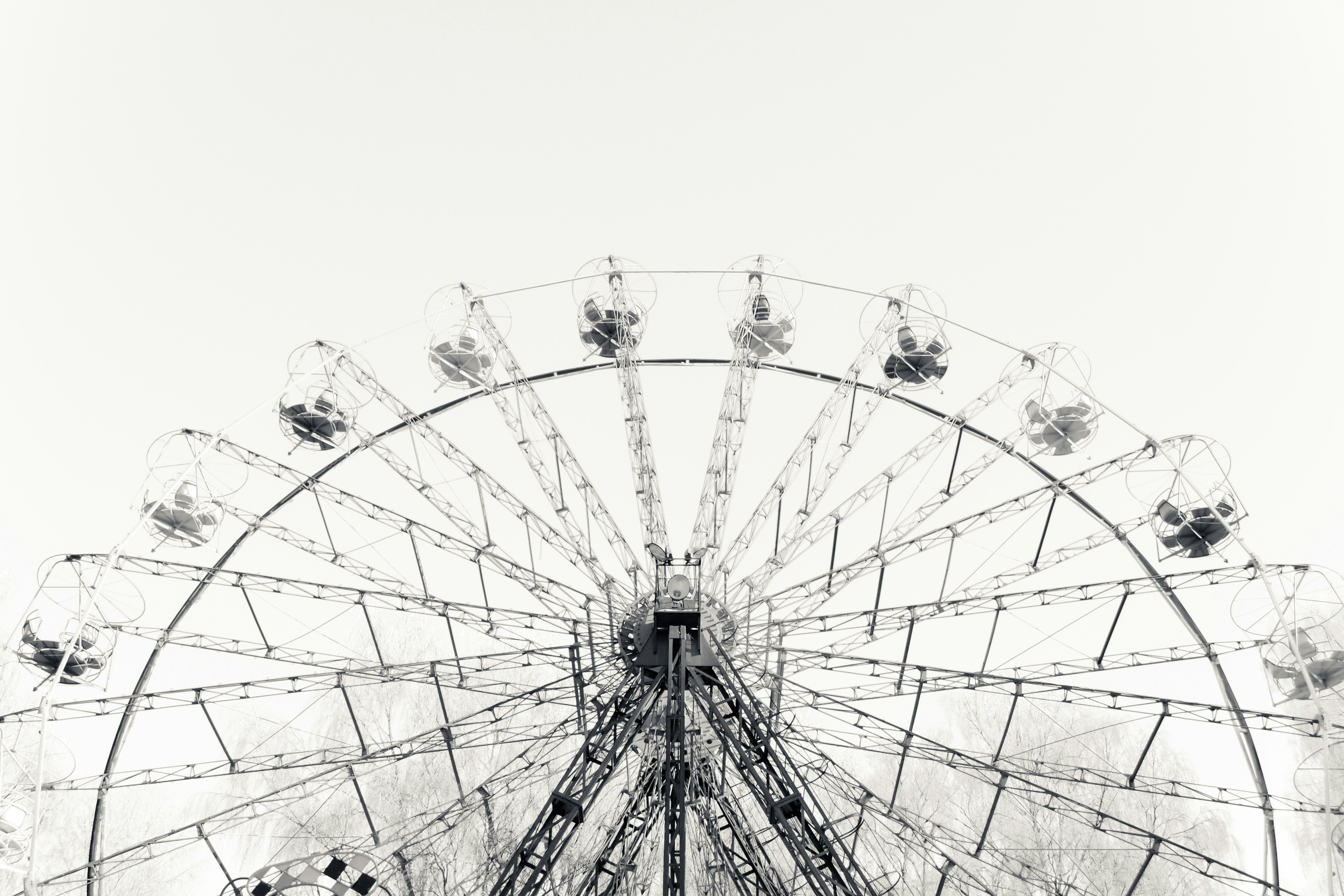 a ferris wheel with a cloudy sky