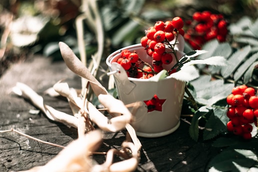 a cup of red berries