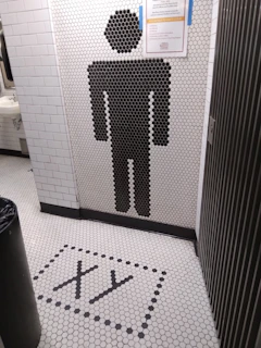 Abstract dark professional image symbolizing cleanliness and hygiene in commercial restrooms.