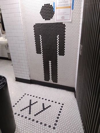 Abstract dark professional image symbolizing cleanliness and hygiene in commercial restrooms.