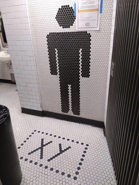 Abstract dark professional image symbolizing cleanliness and hygiene in commercial restrooms.