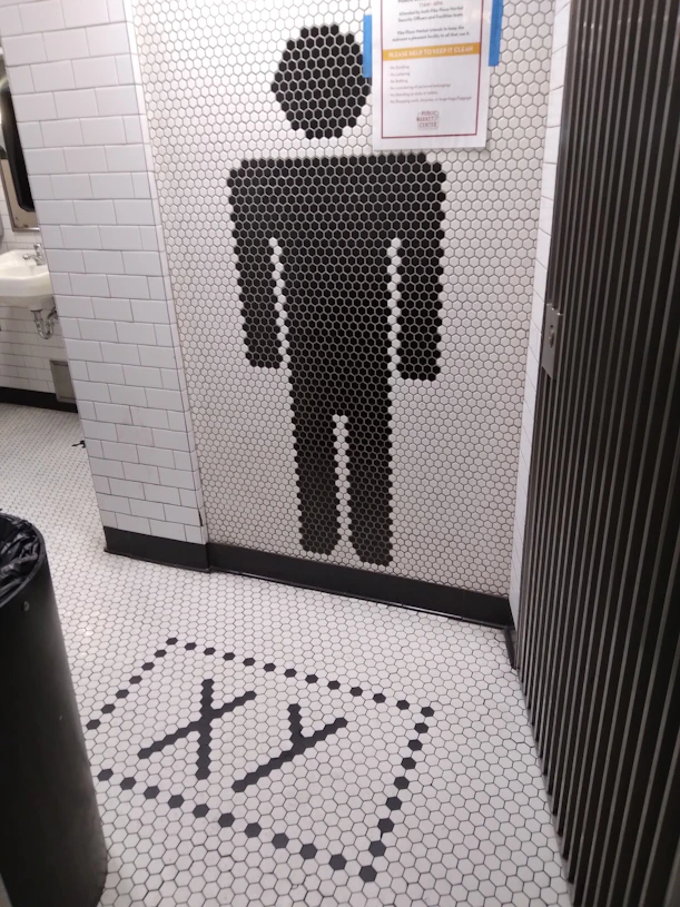 Abstract dark professional image symbolizing cleanliness and hygiene in commercial restrooms.