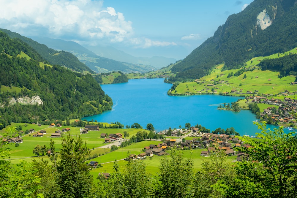 a large body of water with a mountain in the background