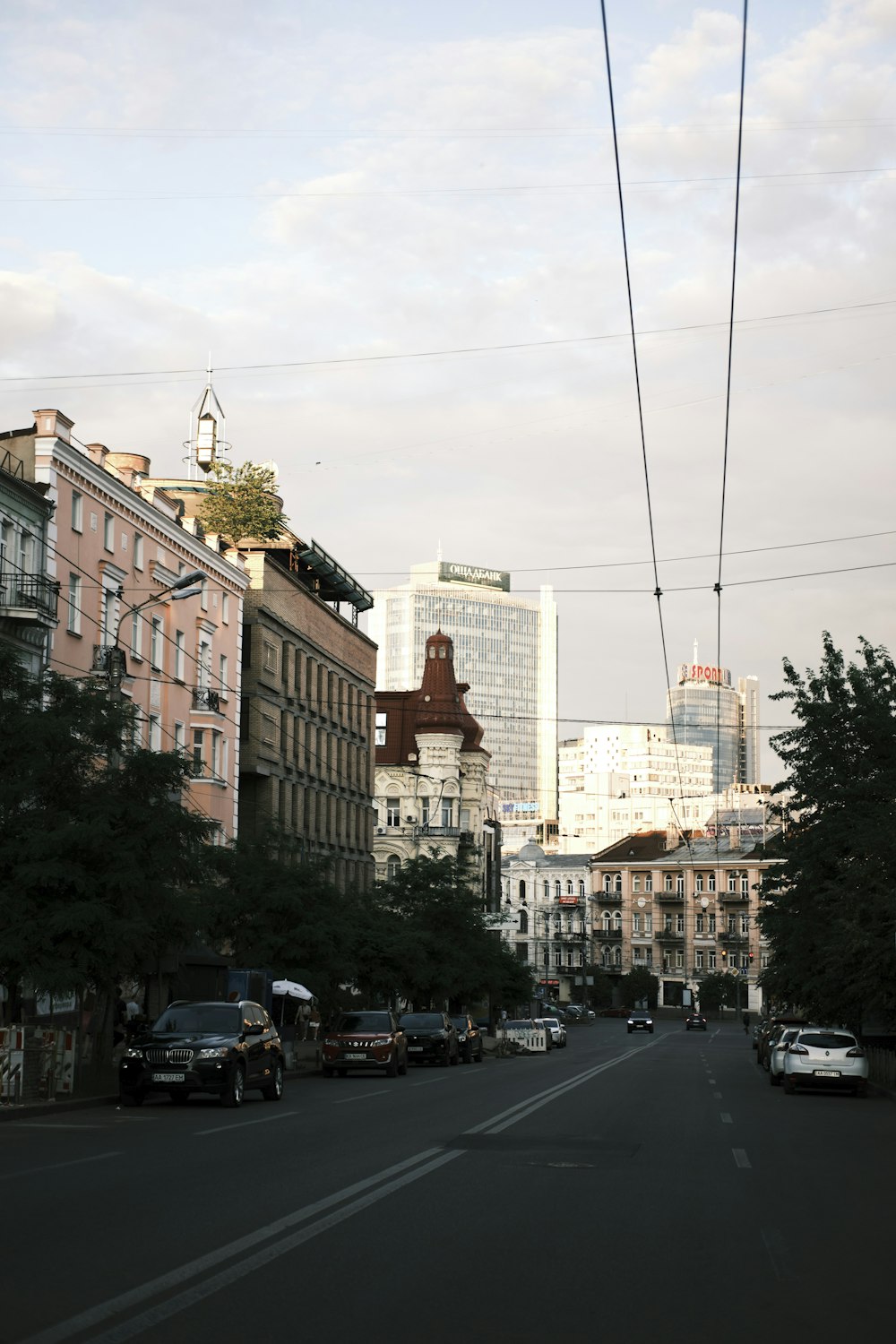 a street with cars and buildings on either side of it