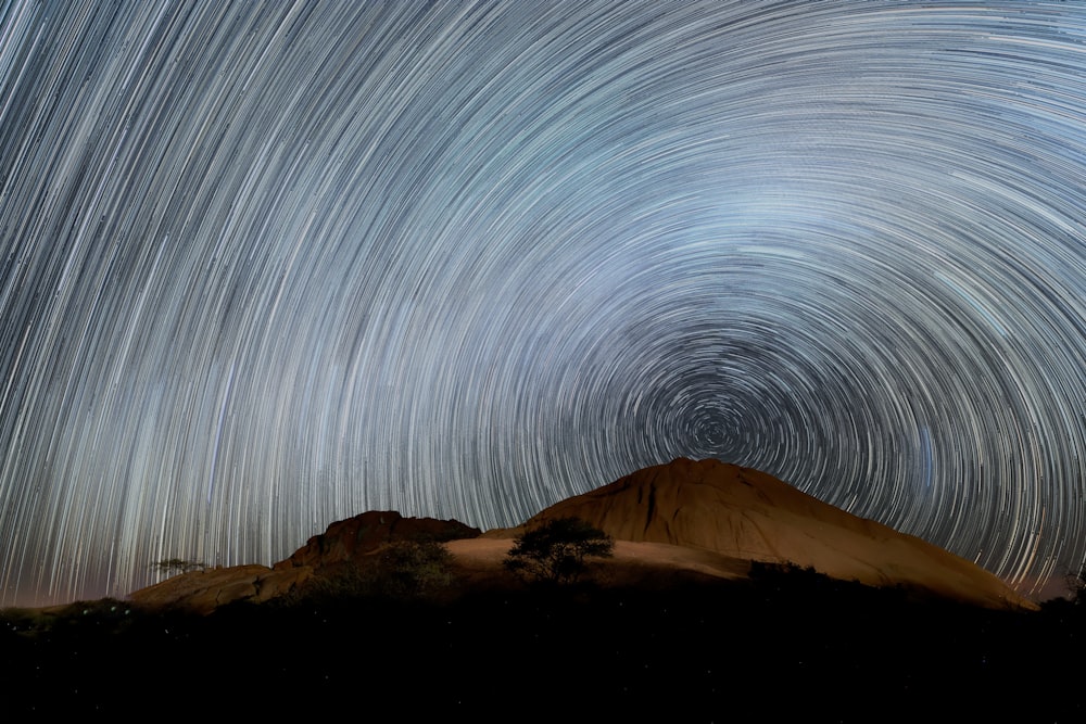 a mountain with stars in the sky