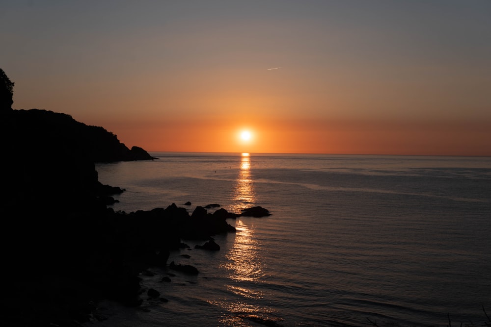 a sunset over a body of water