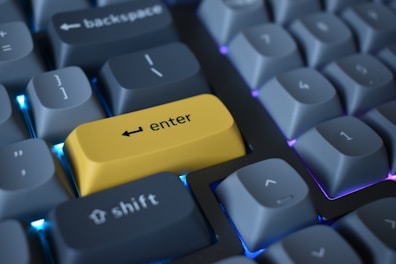 a yellow cell phone on a keyboard