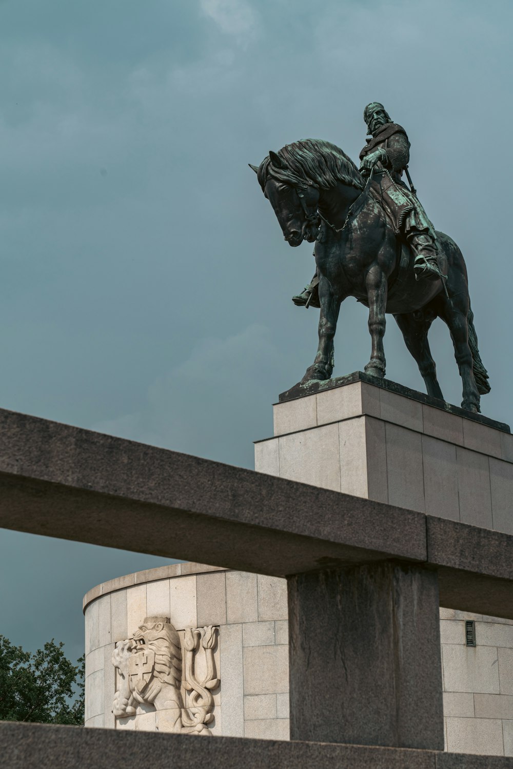 a statue of a person riding a horse