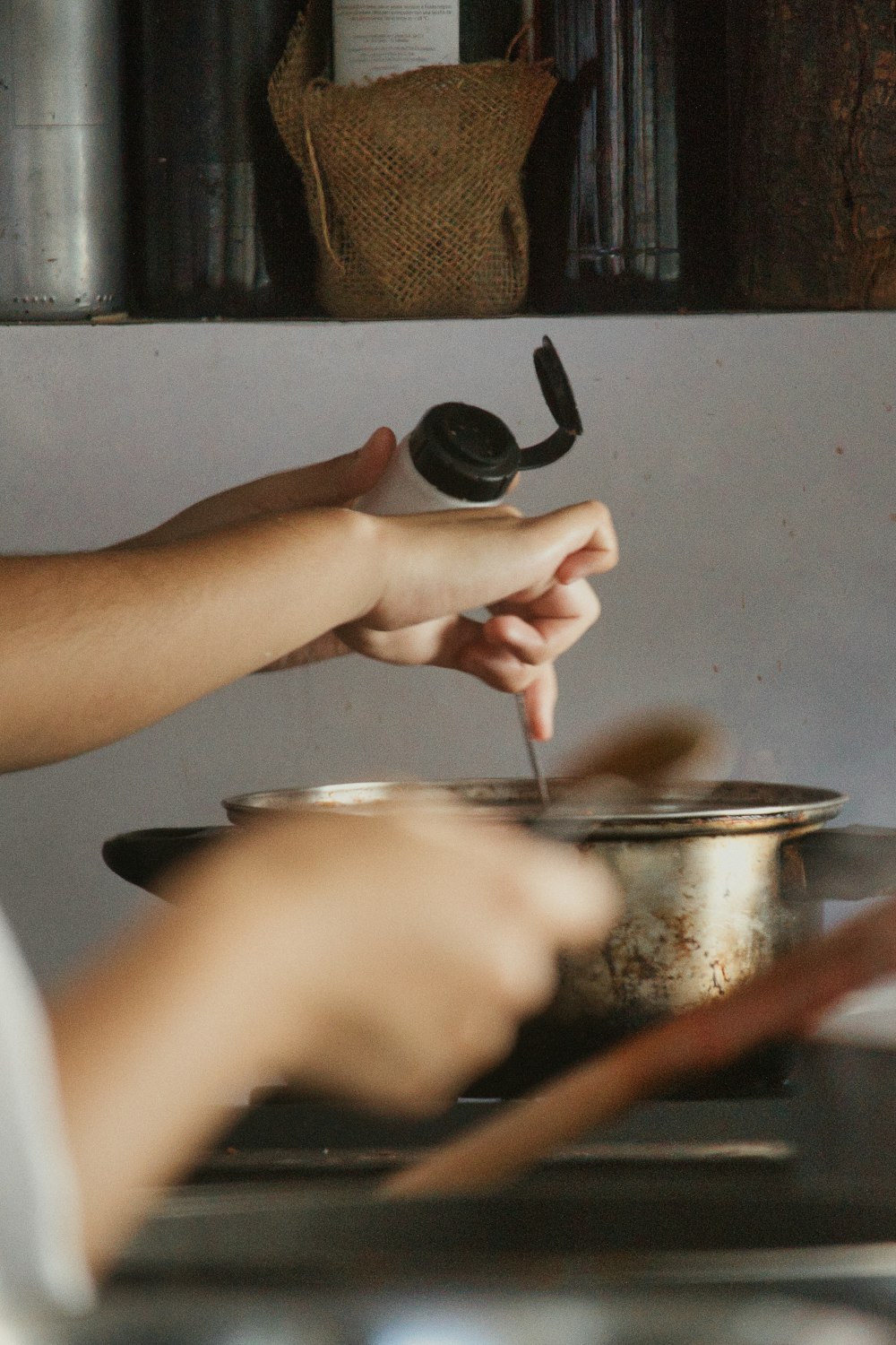 a person cooking food in a pot