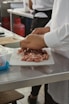 a person holding a tray of food