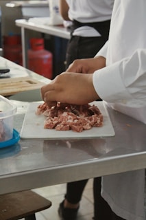 a person holding a tray of food