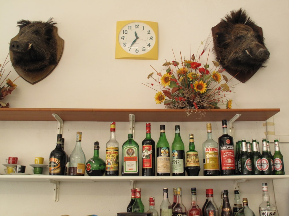 a shelf with bottles of alcohol on it