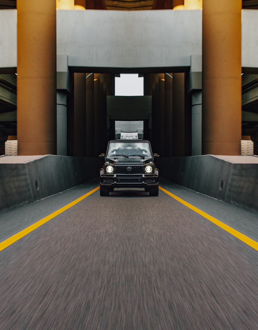 a black car parked in a parking garage