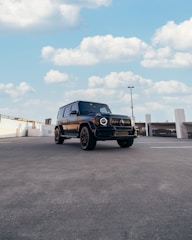 a black truck parked in a parking lot