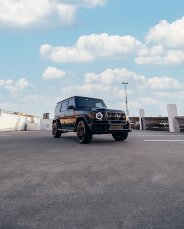 a black truck parked in a parking lot