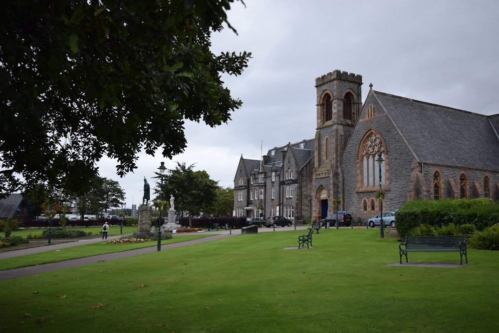 a large building with a lawn in front of it