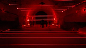 Office space converted into a lively laser tag arena with employees playing.