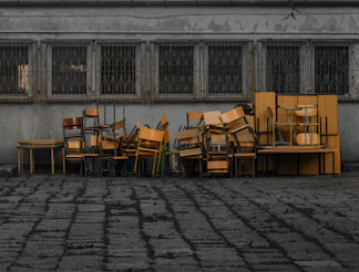 a group of tables and chairs outside a building