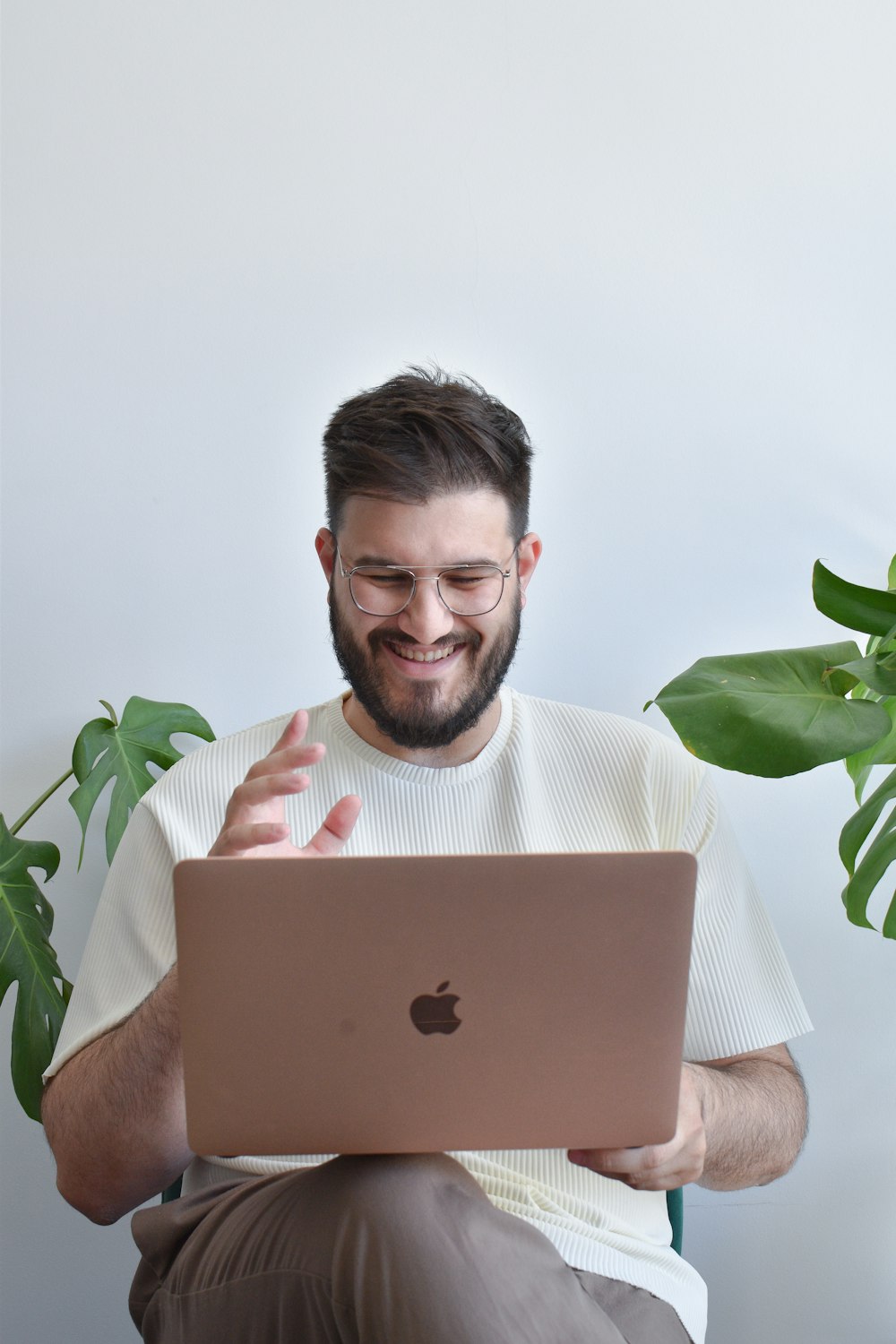 a man holding a laptop