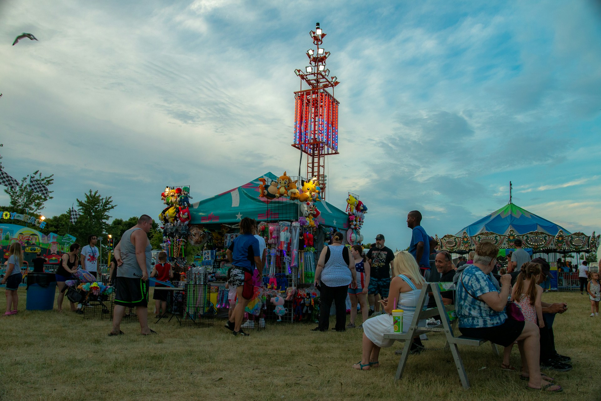 woman wearing yellow long-sleeved dress under white clouds and blue sky during daytime