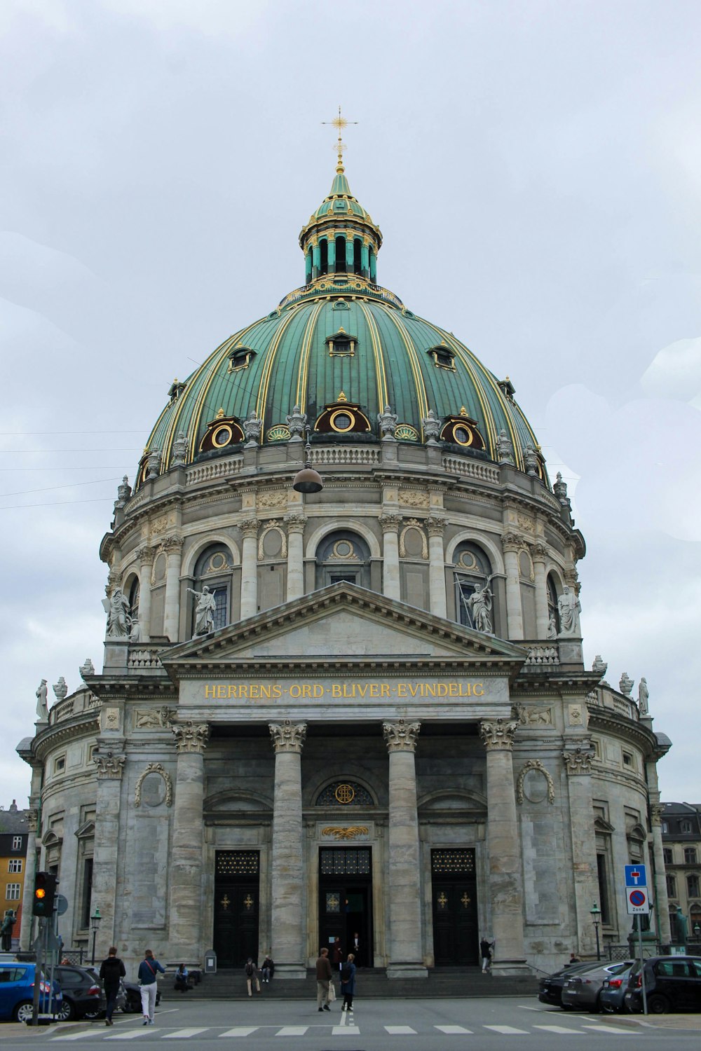 a large building with a dome and columns with Pennsylvania State Capitol in the background