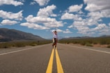 a person riding a bicycle on a road