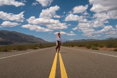 a person riding a bicycle on a road