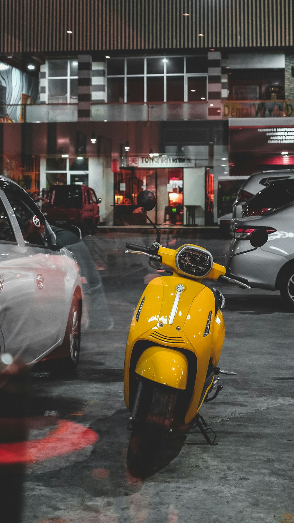 a yellow motorcycle parked in a parking lot