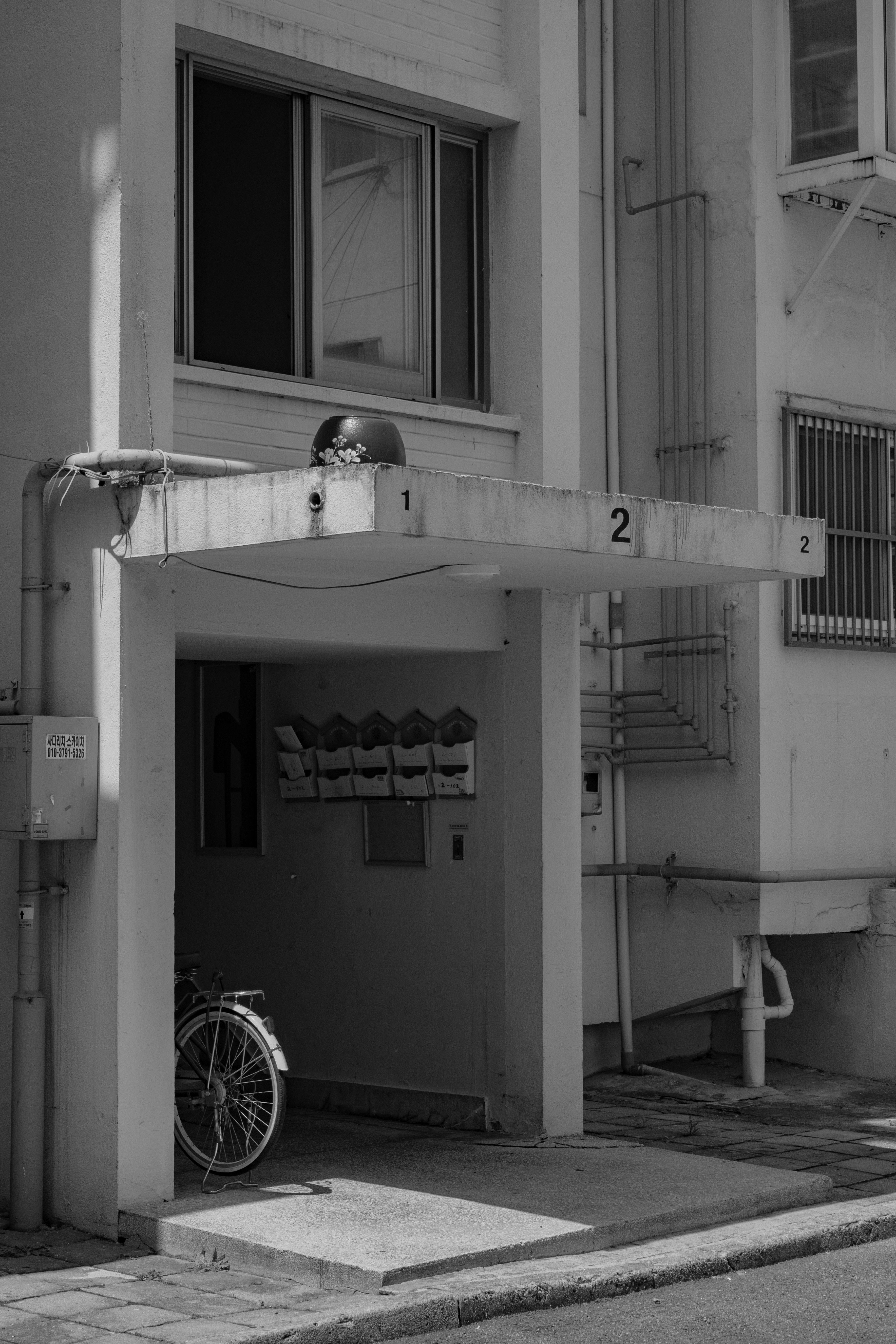a bicycle is parked outside of a building
