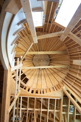 a wooden ceiling with a fan