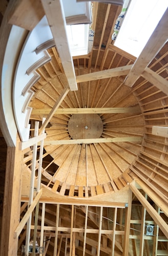 a wooden ceiling with a fan