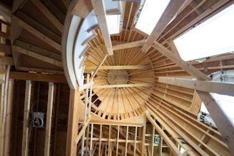 a wooden ceiling with a fan
